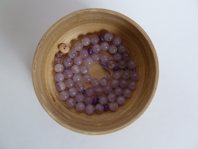 Master Healer necklace spiral in bamboo bowl