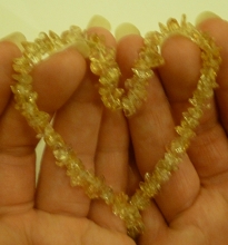 Citrine necklace held in shape of a heart to help open the heart to light and sound energy